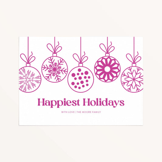 Personalized holiday card with modern hanging ornaments and Happiest Holidays message in magenta.