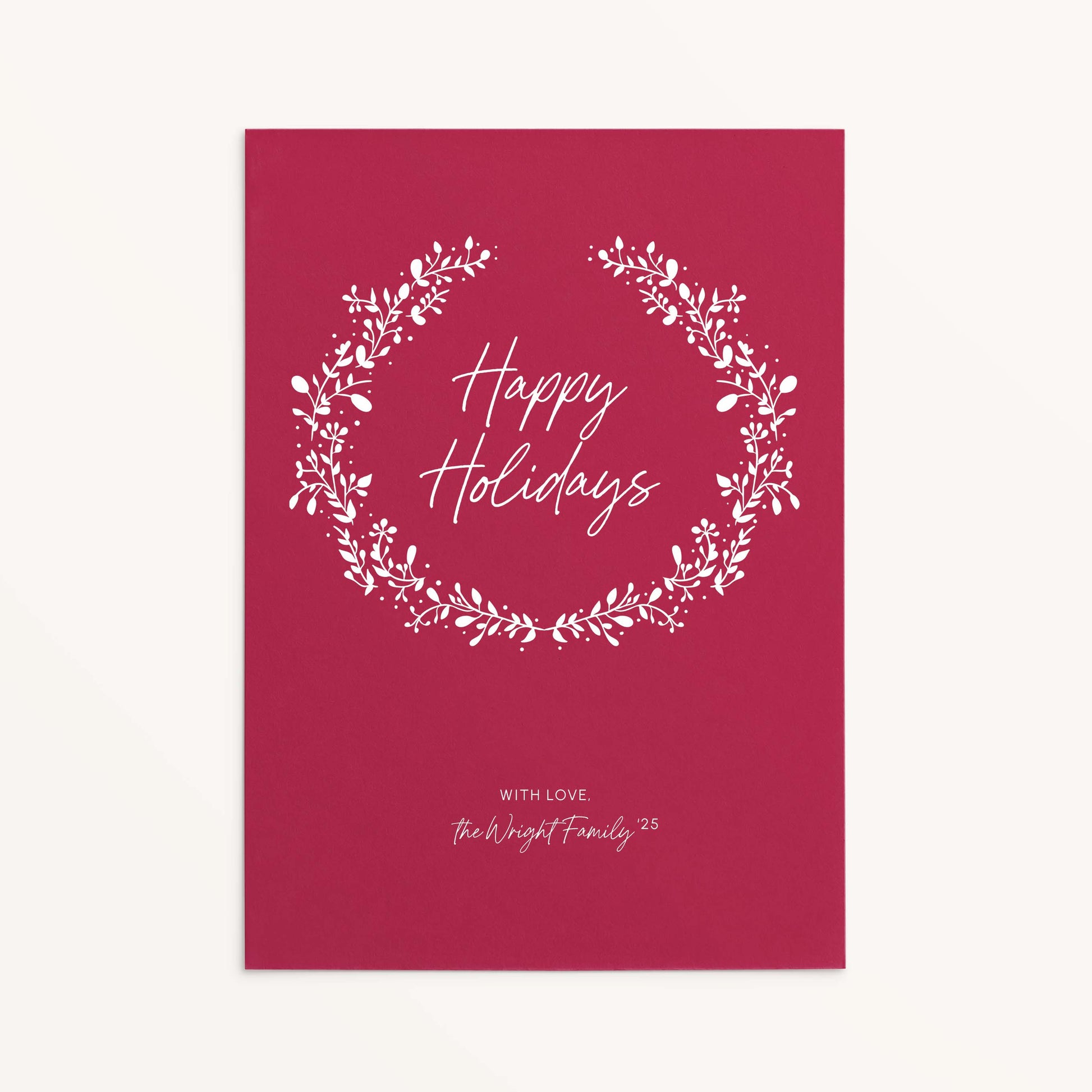 Personalized red holiday card with white botanical wreath and Happy Holidays text.