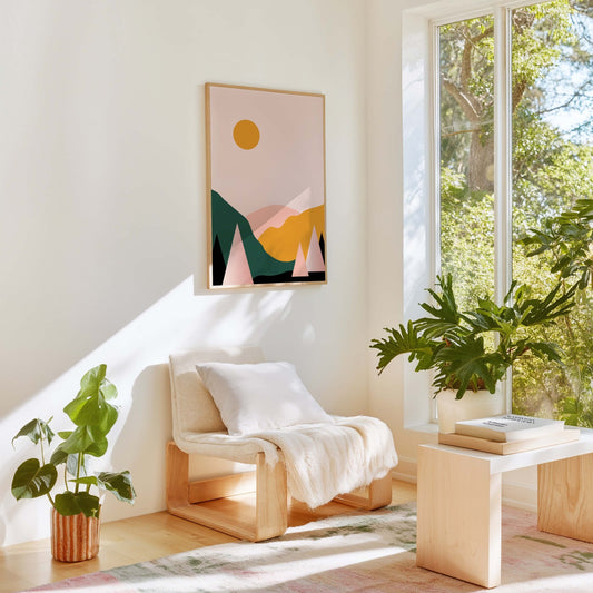 Minimalist mountain landscape wall art styled in bright living room with plants and neutral decor