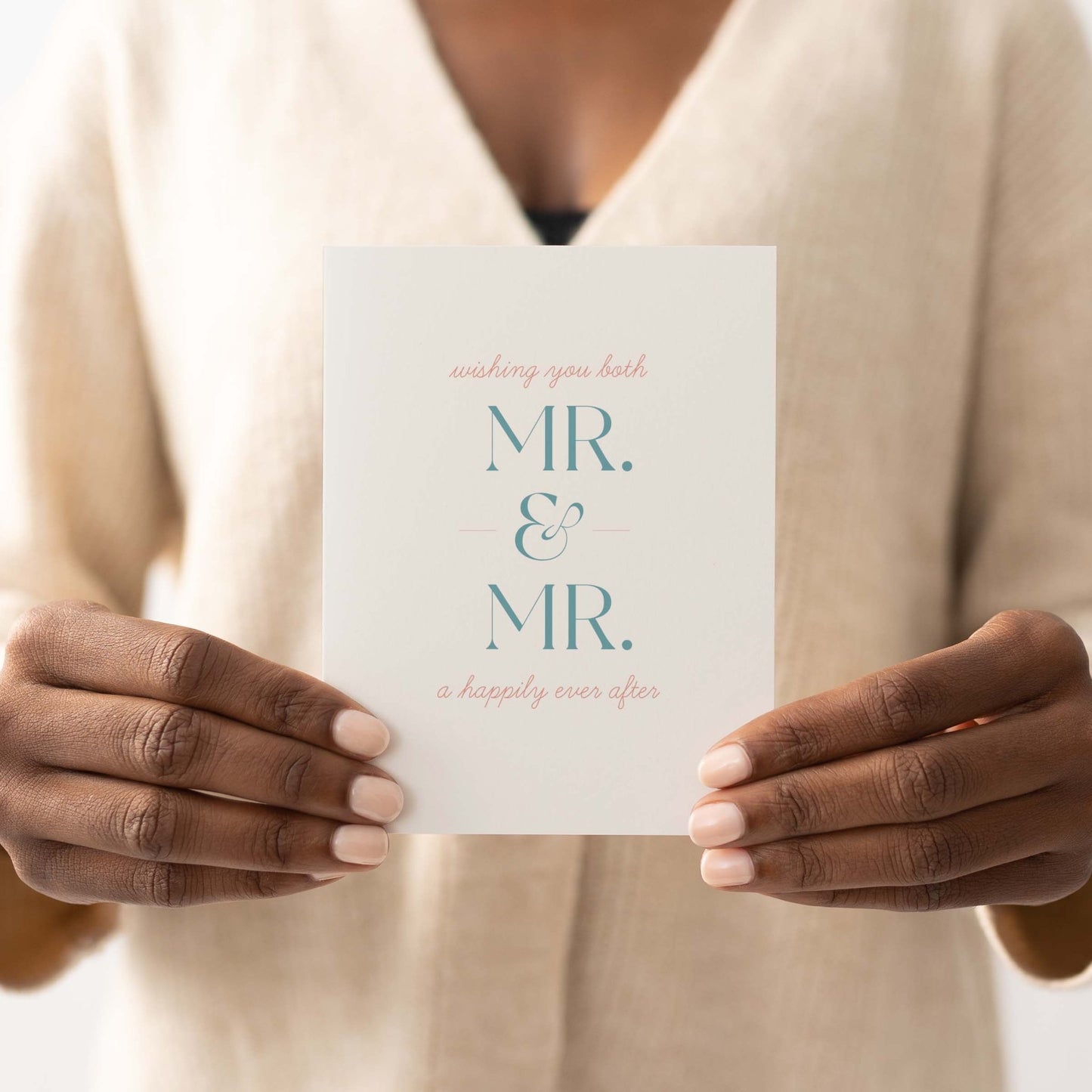 Person holding Mr. + Mr. wedding greeting card, minimal modern design