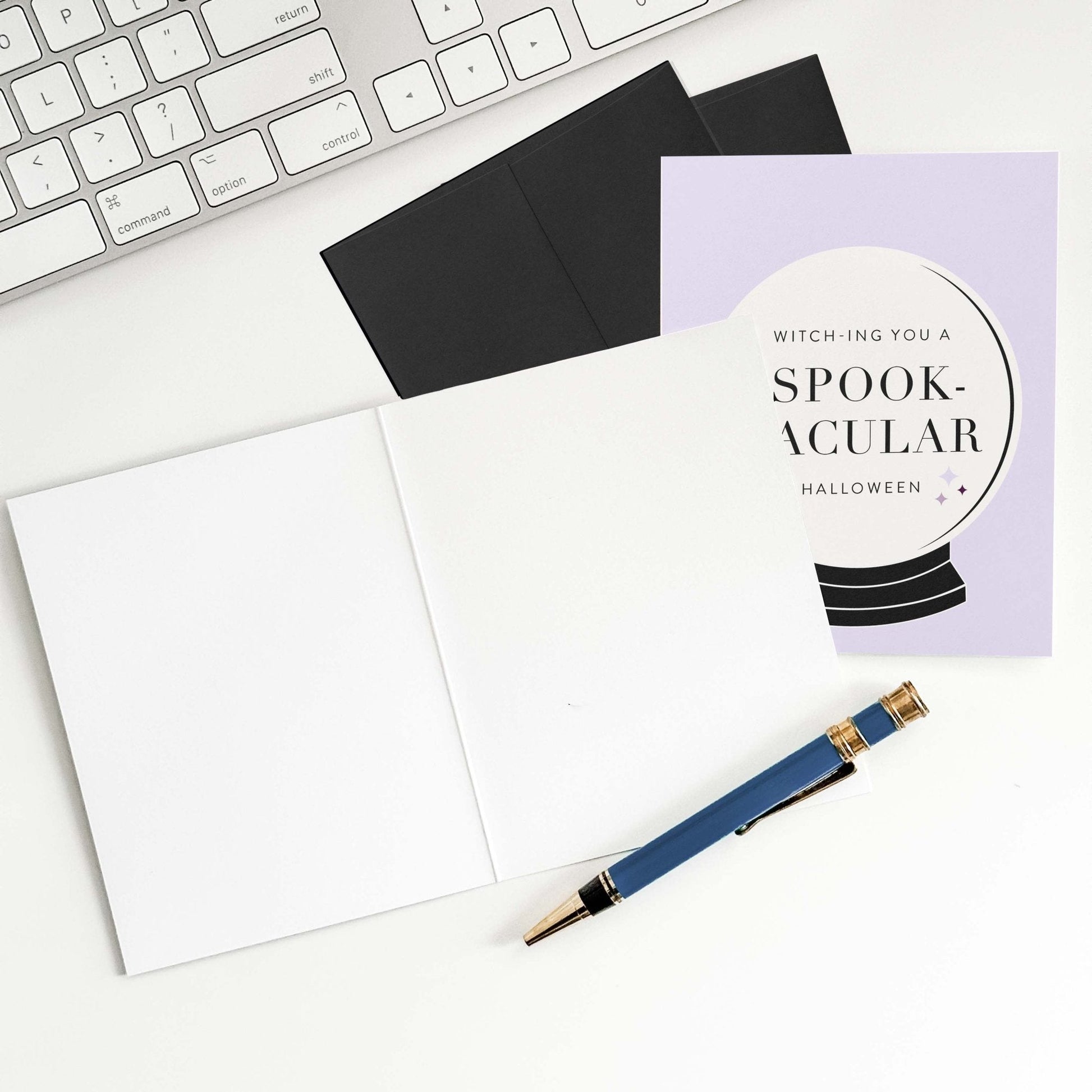 Funny witchy Halloween greeting card shown with envelope and pen, perfect for sending spooky-chic vibes.