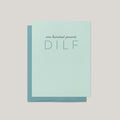 100% DILF funny Father's Day greeting card by Blú Rose, pale mint card with tonal blue lettering, shown with matching blue envelope