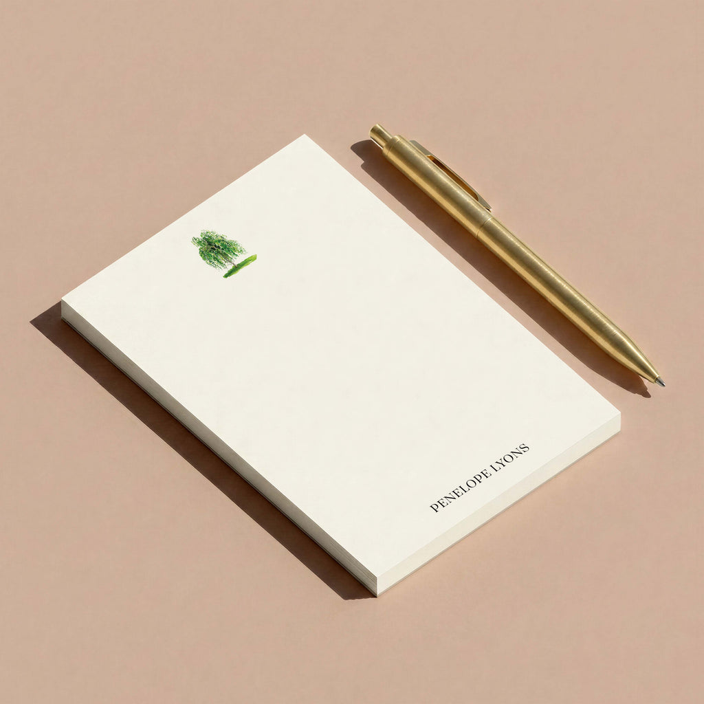 Birch personalized notepad by Blú Rose, birch tree notepad styled at an angle with a gold pen on a mauve surface