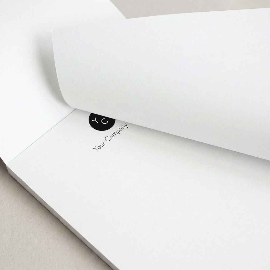 Custom Logo notepad by Blú Rose, close-up of the custom logo with the top sheet lifted