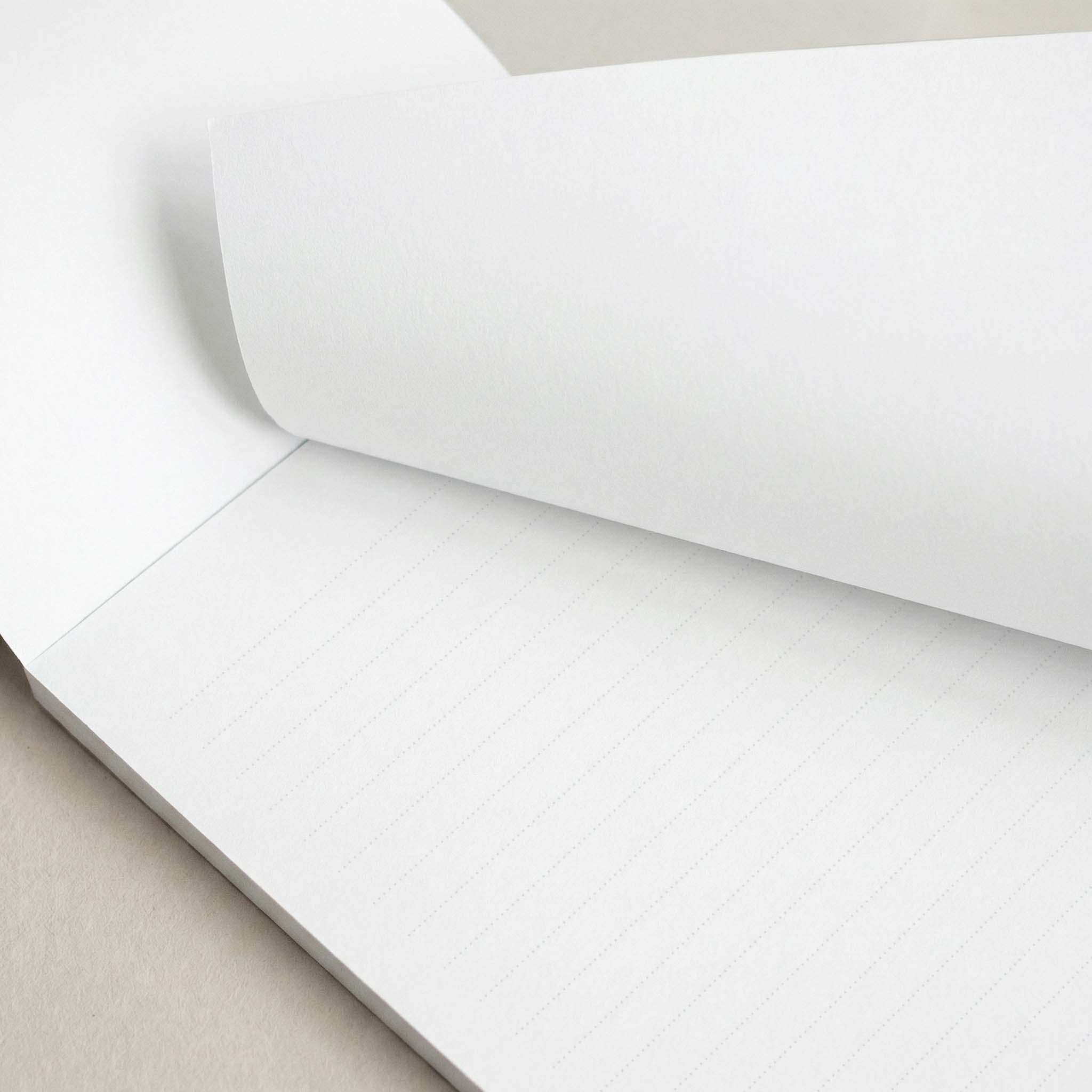 Elegant Green personalized notepad by Blú Rose, close-up of the lined pages with the top sheet lifted