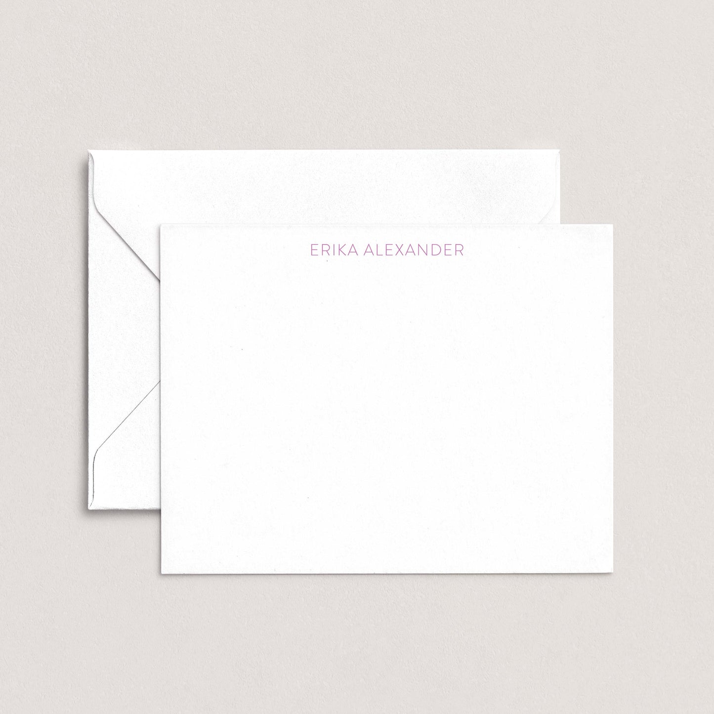 Personalized notecard with the name Erika Alexander in soft lavender font, paired with a white envelope on a neutral background.