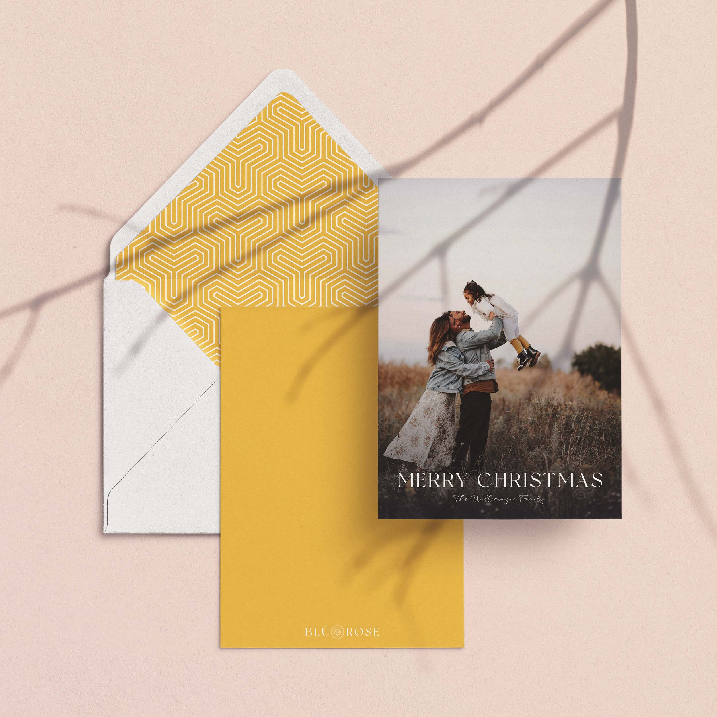 Golden Hour card with its golden geometric envelope liner and matching golden backer on a blush backdrop