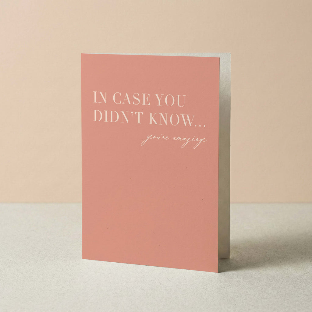 A vertical greeting card in a dusty pink color with white text that reads 'IN CASE YOU DIDN'T KNOW... you're amazing