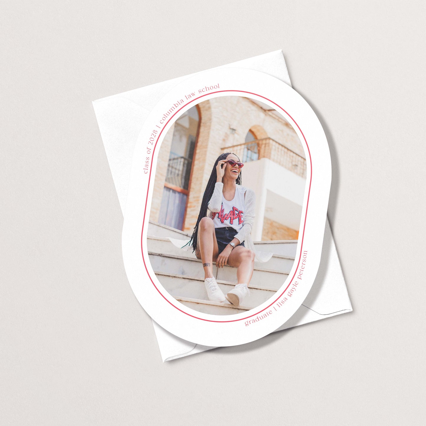 Minimal Geo graduation announcement card with oval photo cutout showing grad sitting on steps, with personalized name and school details
