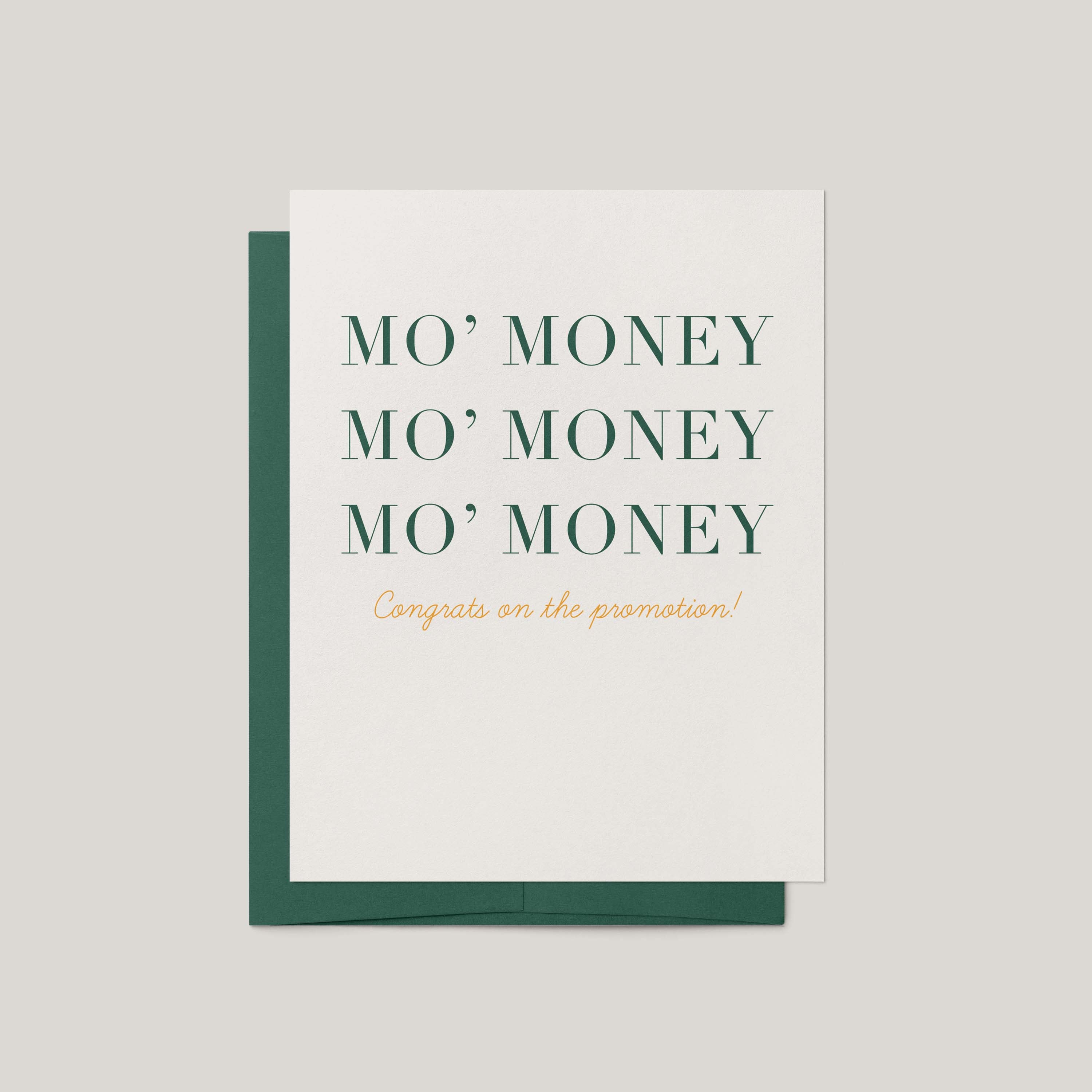 A white greeting card with a dark green envelope behind it, printed with the phrase 'MO' MONEY MO' MONEY MO' MONEY' in dark green serif letters and 'Congrats on the promotion!' in small gold script below, on a light gray background.