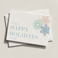 Modern Snowflake landscape card with pastel blue and coral snowflakes and HAPPY HOLIDAYS
