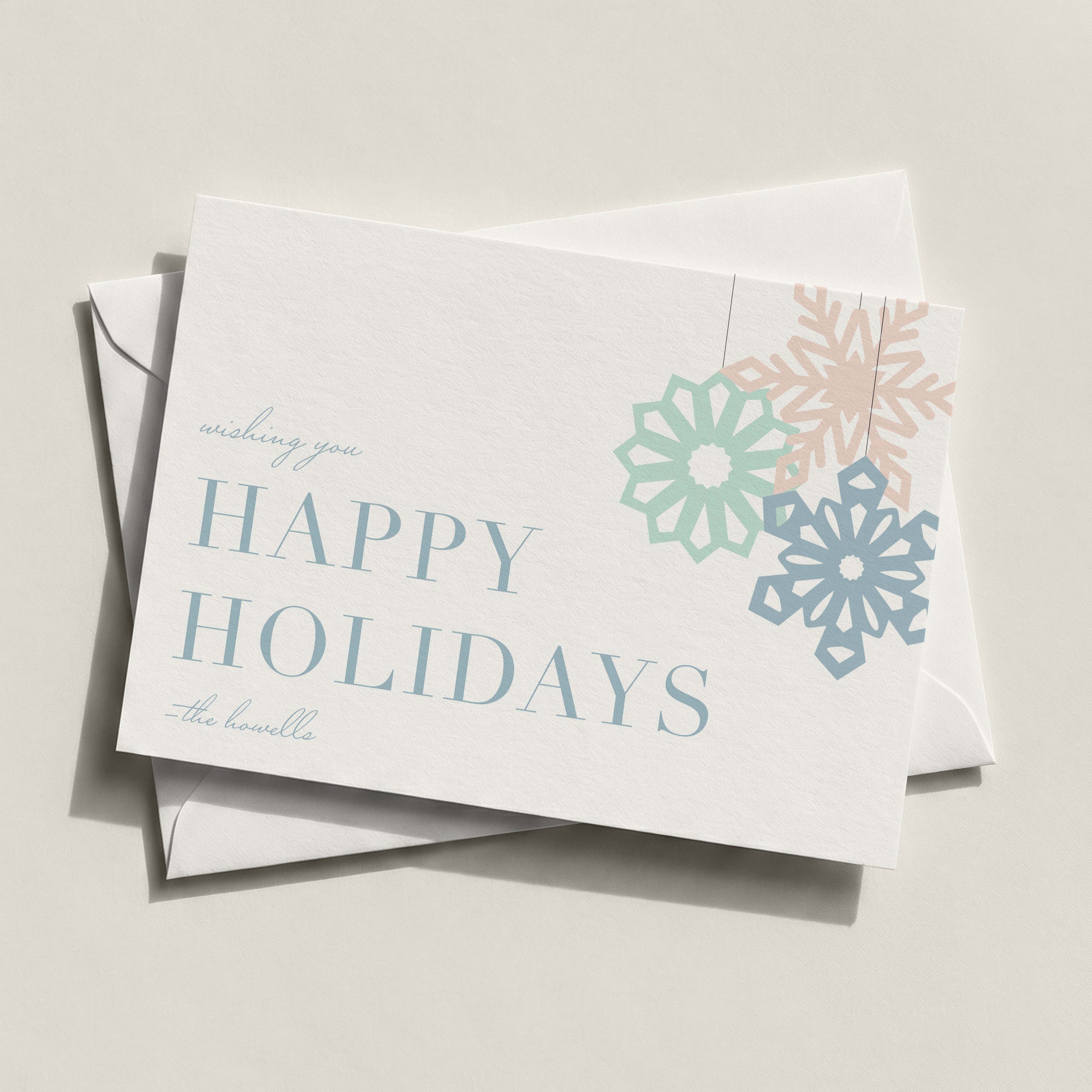 Modern Snowflake landscape card with pastel blue and coral snowflakes and HAPPY HOLIDAYS