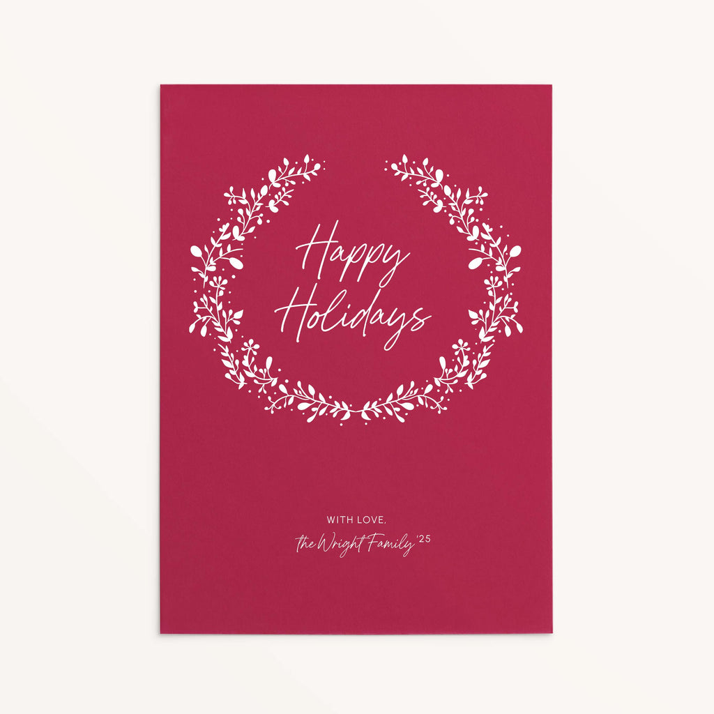 Personalized red holiday card with white botanical wreath and Happy Holidays text.