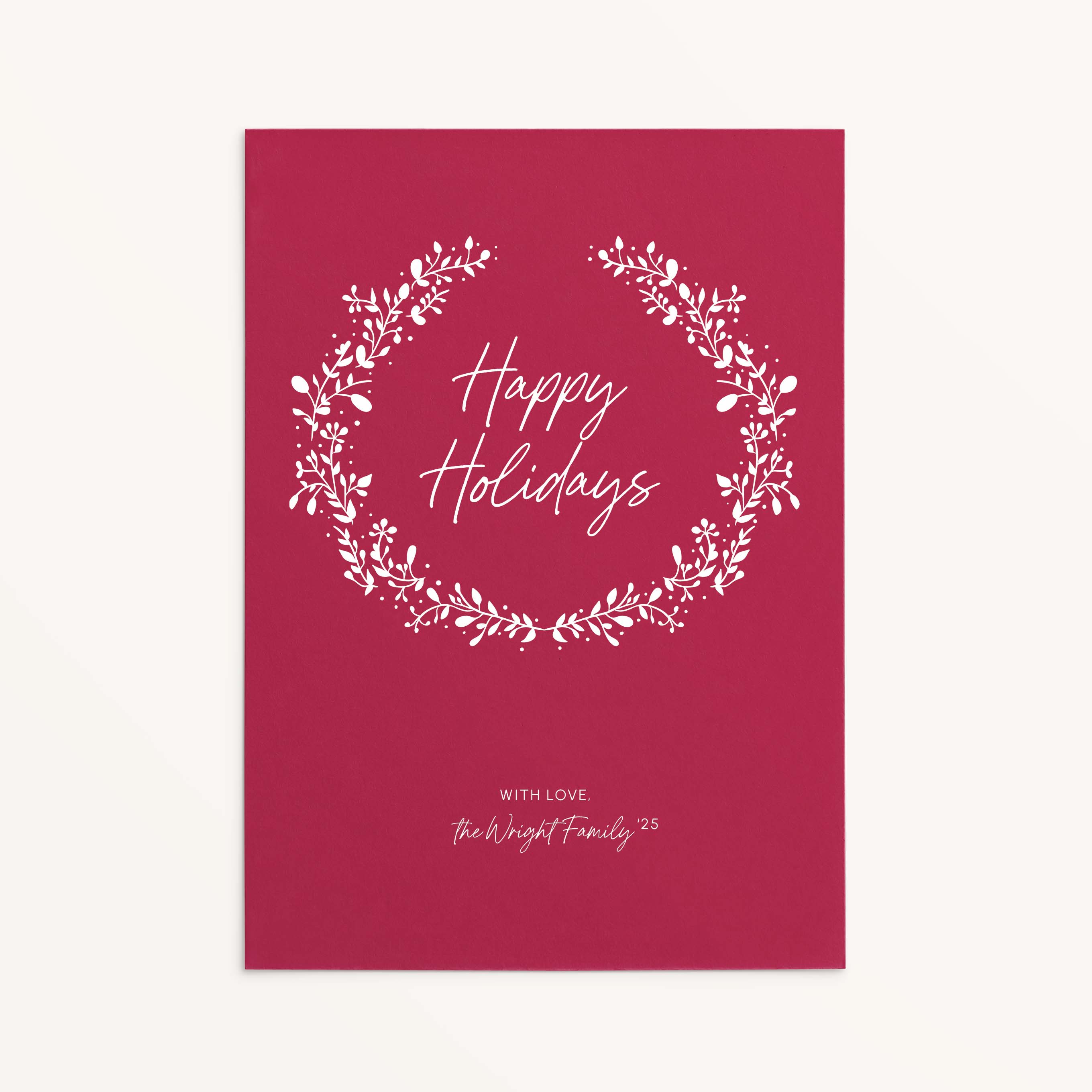 Personalized red holiday card with white botanical wreath and Happy Holidays text.