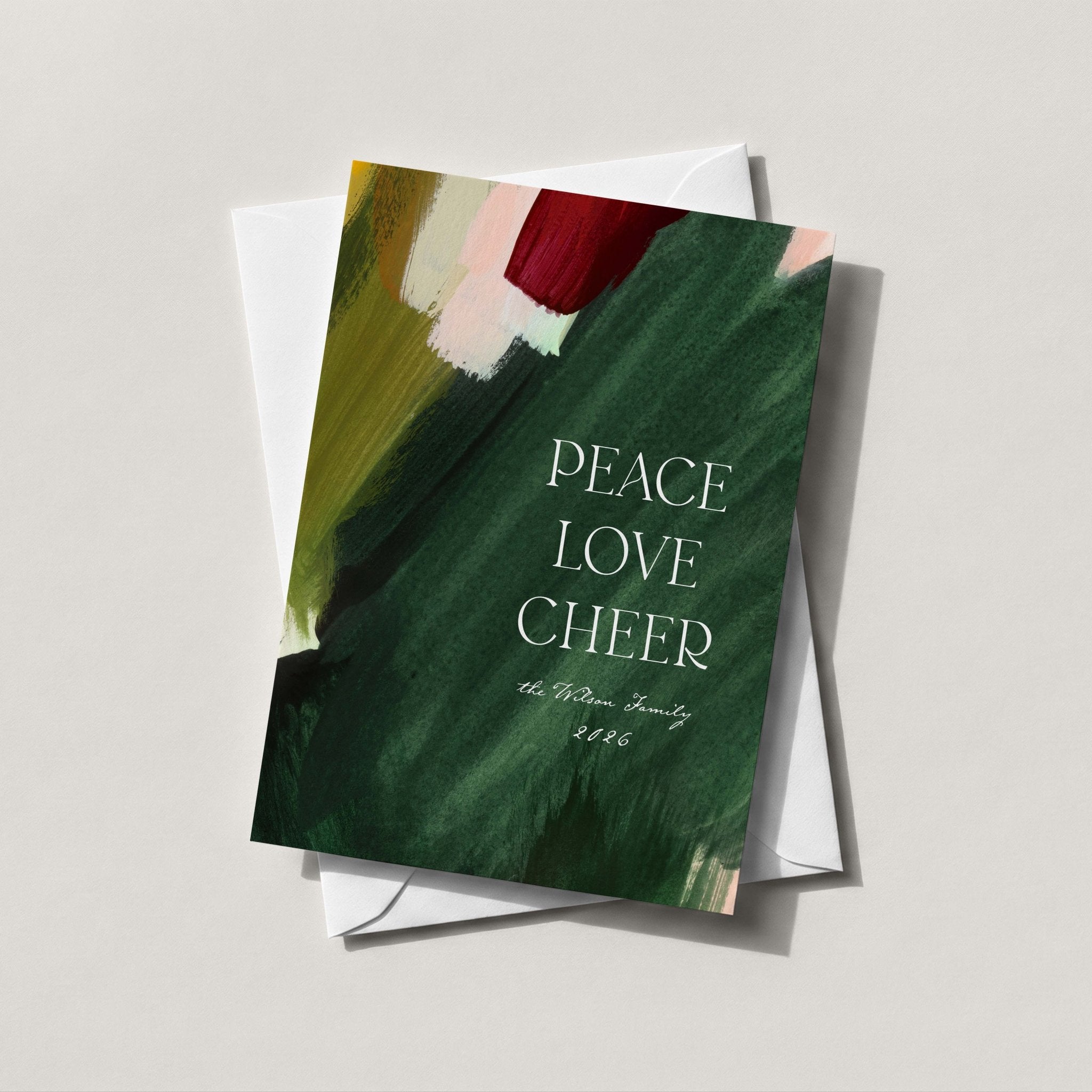 Abstract Brushstroke holiday card in deep forest green with a painted brushstroke and PEACE LOVE CHEER
