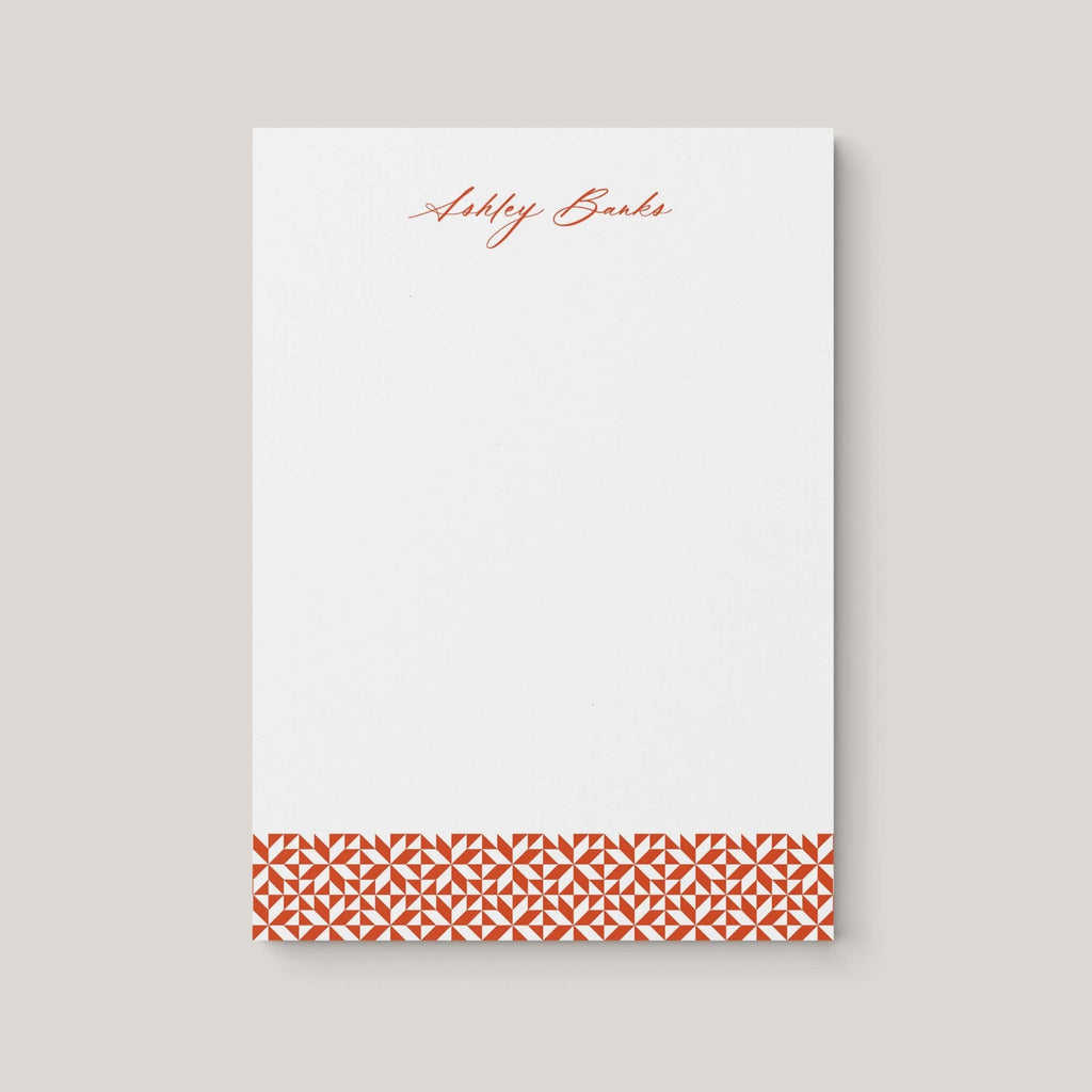 Ashley Pattern personalized notepad by Blú Rose, white notepad with the name 'Ashley Banks' in rust script and a rust geometric border