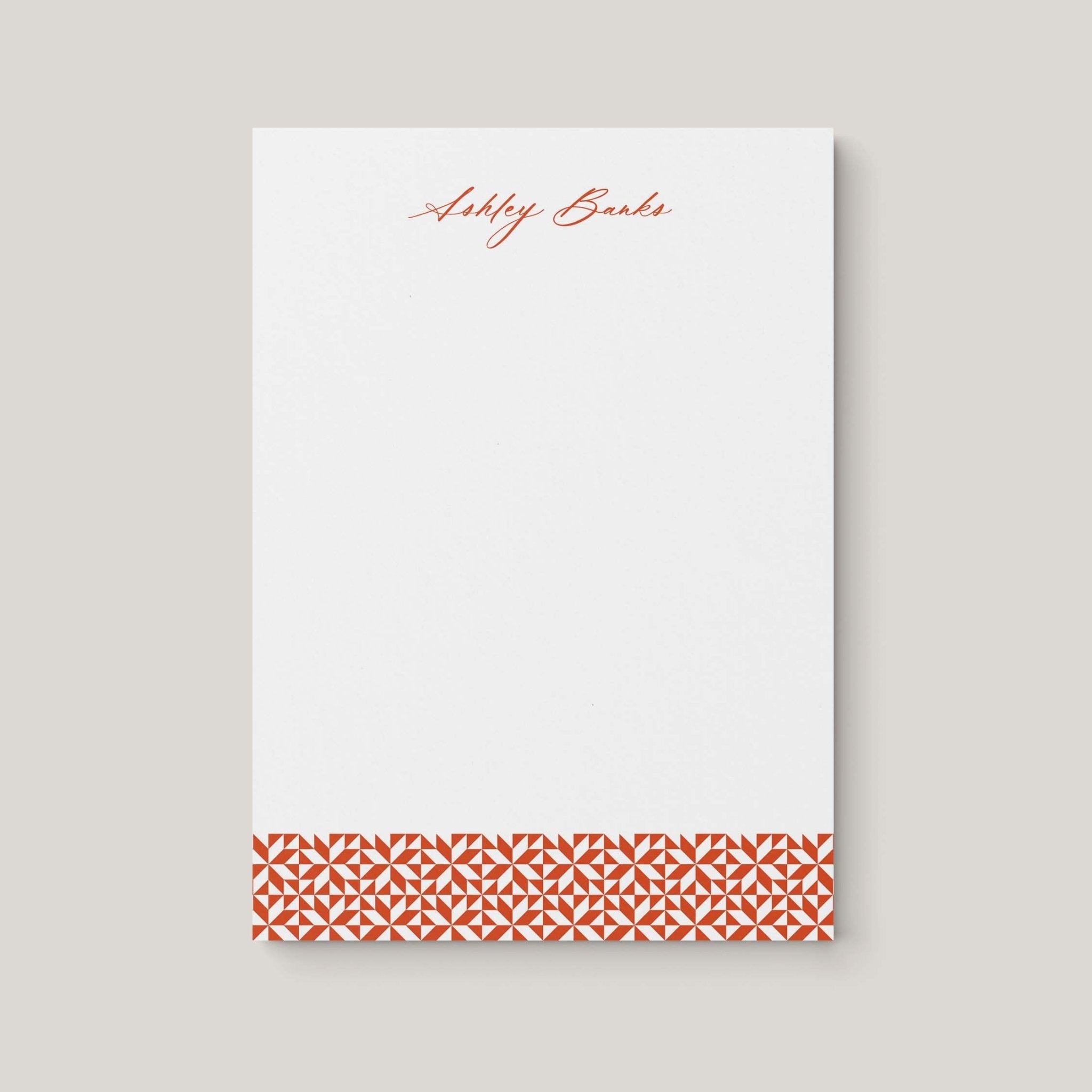 Ashley Pattern personalized notepad by Blú Rose, white notepad with the name 'Ashley Banks' in rust script and a rust geometric border