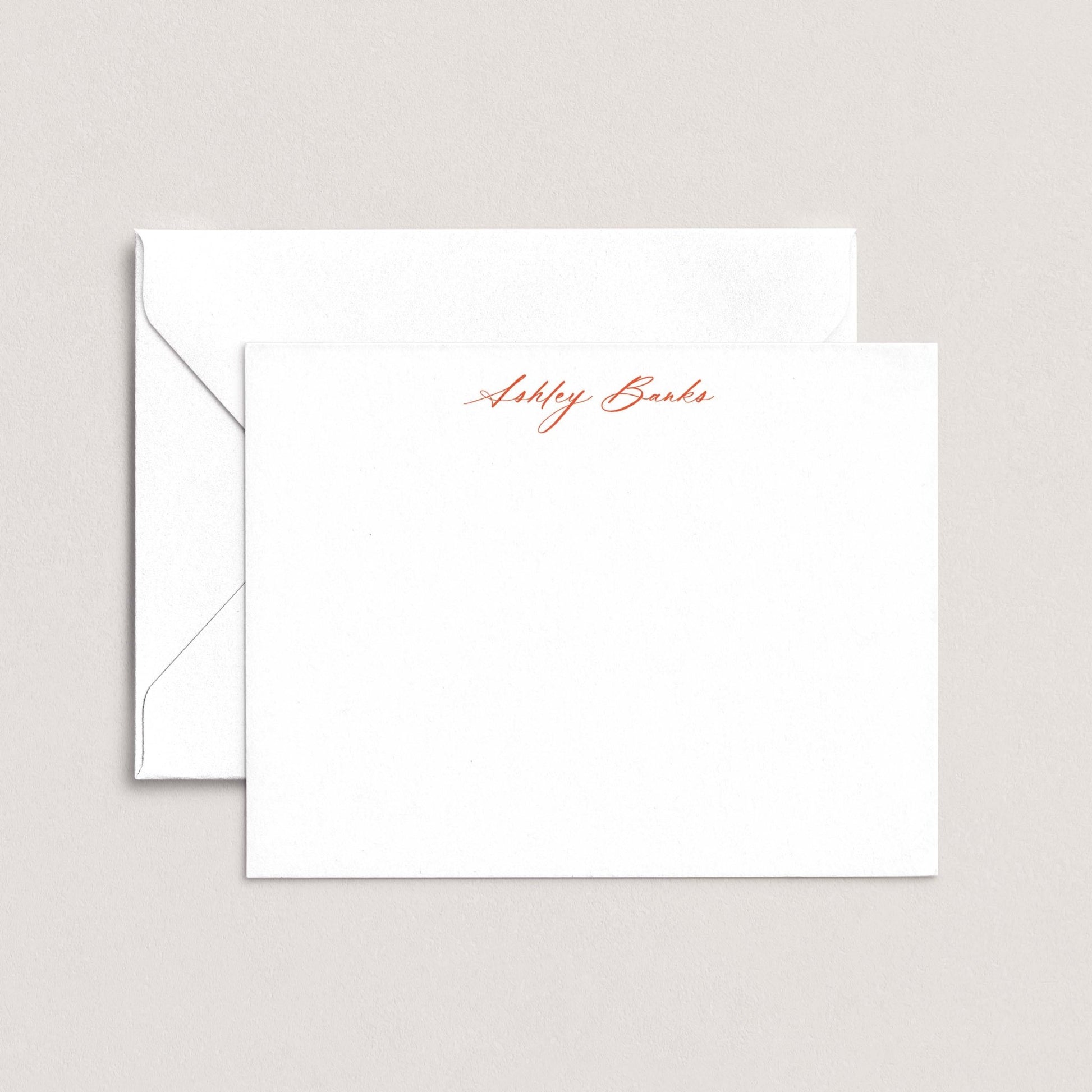 A white envelope with a personalized note inside, featuring the name "Ashley Bards" written in red cursive script.