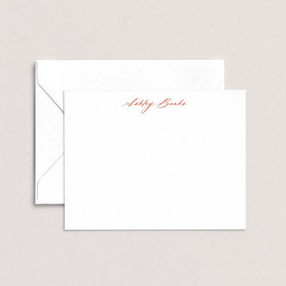 A white envelope with a personalized note inside, featuring the name "Ashley Bards" written in red cursive script.