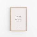 Light wood framed Audre Lorde feminist quote print centered on clean neutral background