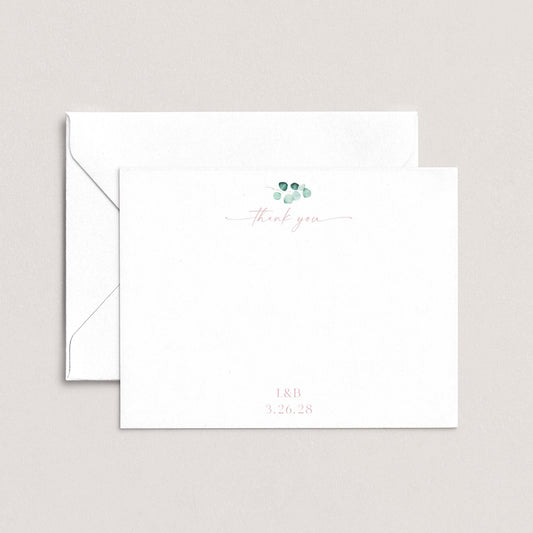 A white envelope with a cursive "Thank you" message and a date printed on it.