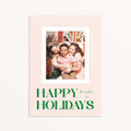 Blush Frame Happy Holidays photo card featuring family photo with bold green serif lettering.
