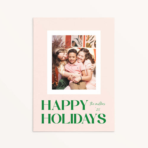 Blush Frame Happy Holidays photo card featuring family photo with bold green serif lettering.