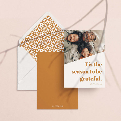 Bold Letters card with its golden lattice envelope liner styled on a blush backdrop