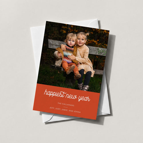 Bottom Color Block photo card with a family photo above a burnt orange band reading happiest new year