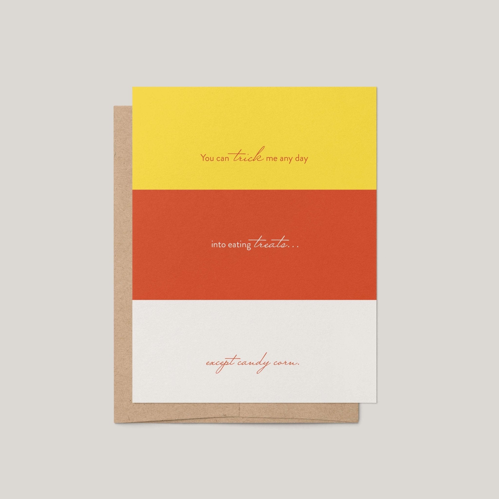 Candy Corn Halloween greeting card by Blú Rose, yellow orange and white candy corn striped card with funny treats text, shown with kraft envelope