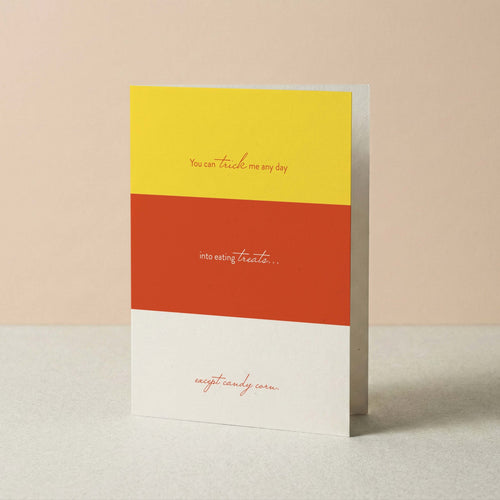 Candy Corn Halloween card by Blú Rose standing upright, candy corn color-block design on a neutral background
