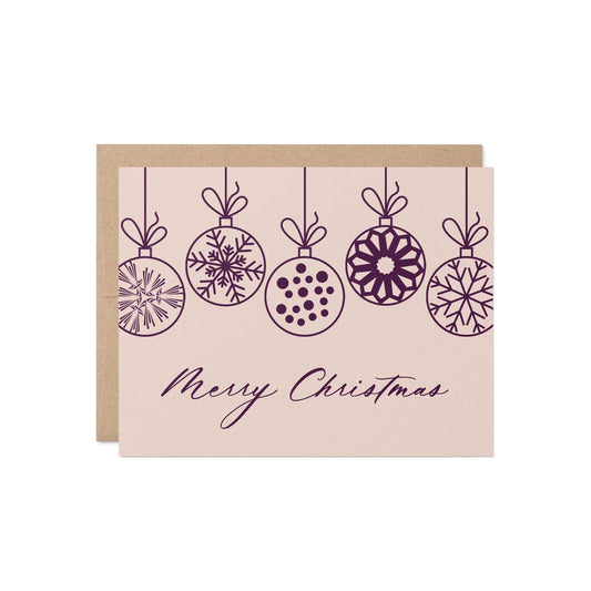 Christmas Ornaments Greeting Card in pink and plum with kraft envelope, reading “Merry Christmas.”