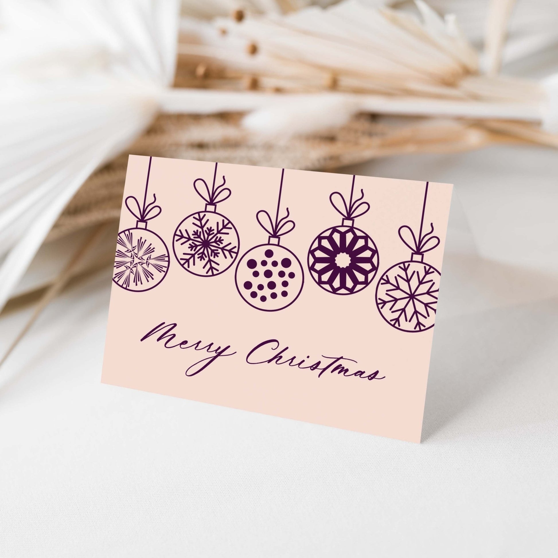 Close-up of Christmas Ornaments Greeting Card styled with neutral holiday decor.