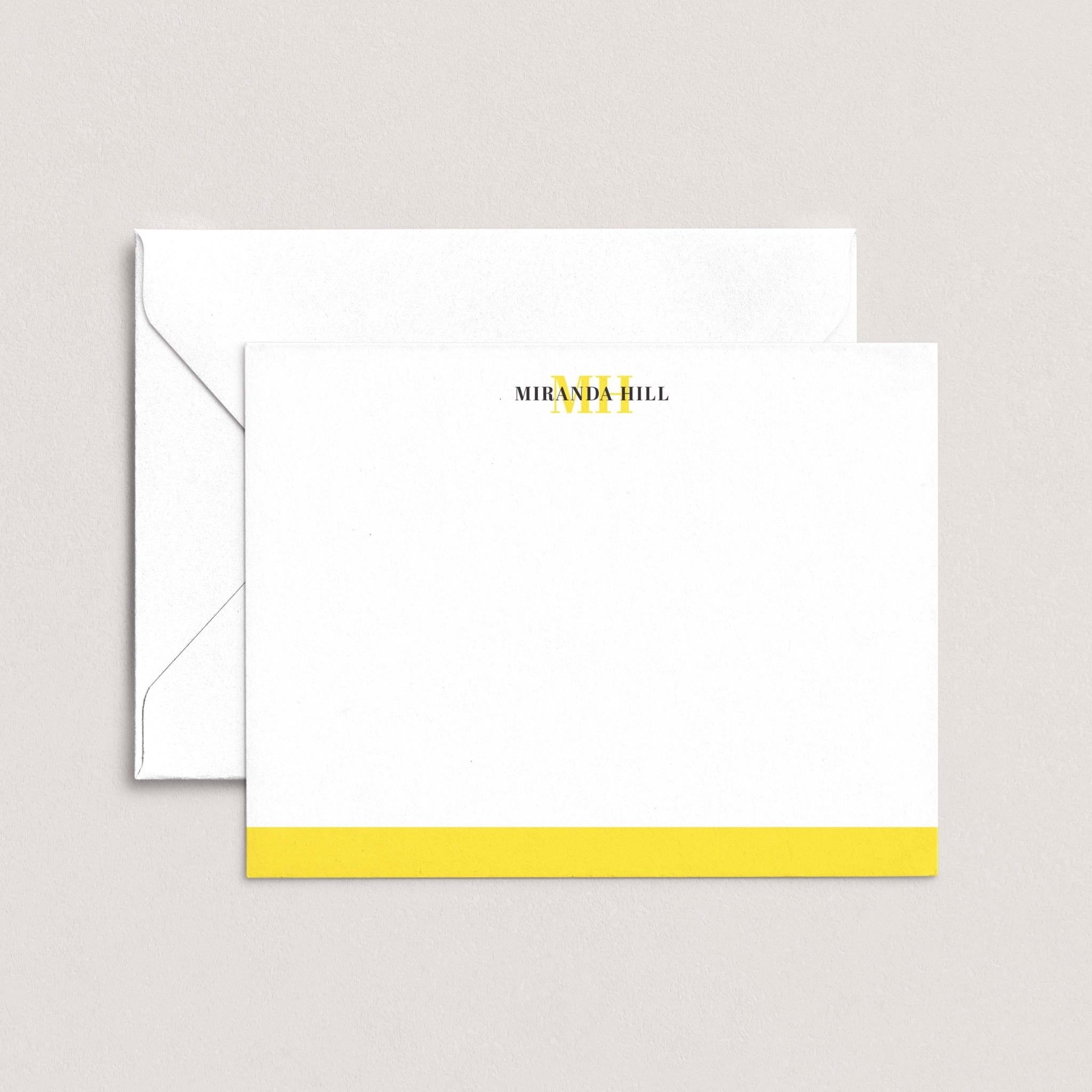 Color Bar personalized notecards by Blú Rose, white flat notecard with the name 'Miranda Hill', a yellow monogram and a yellow bottom color bar, shown with a coordinating white envelope