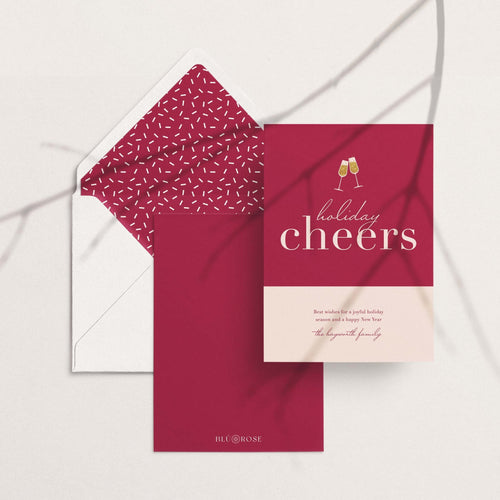 Color Block Cheers card with its burgundy speckled envelope liner styled on a blush backdrop
