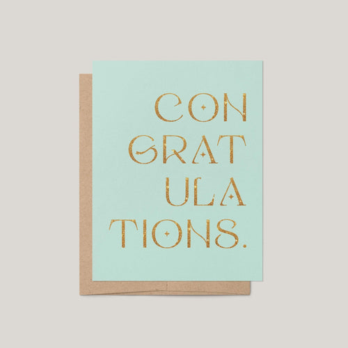 Congratulations greeting card by Blú Rose, mint green card with gold glitter congratulations lettering, shown with kraft envelope