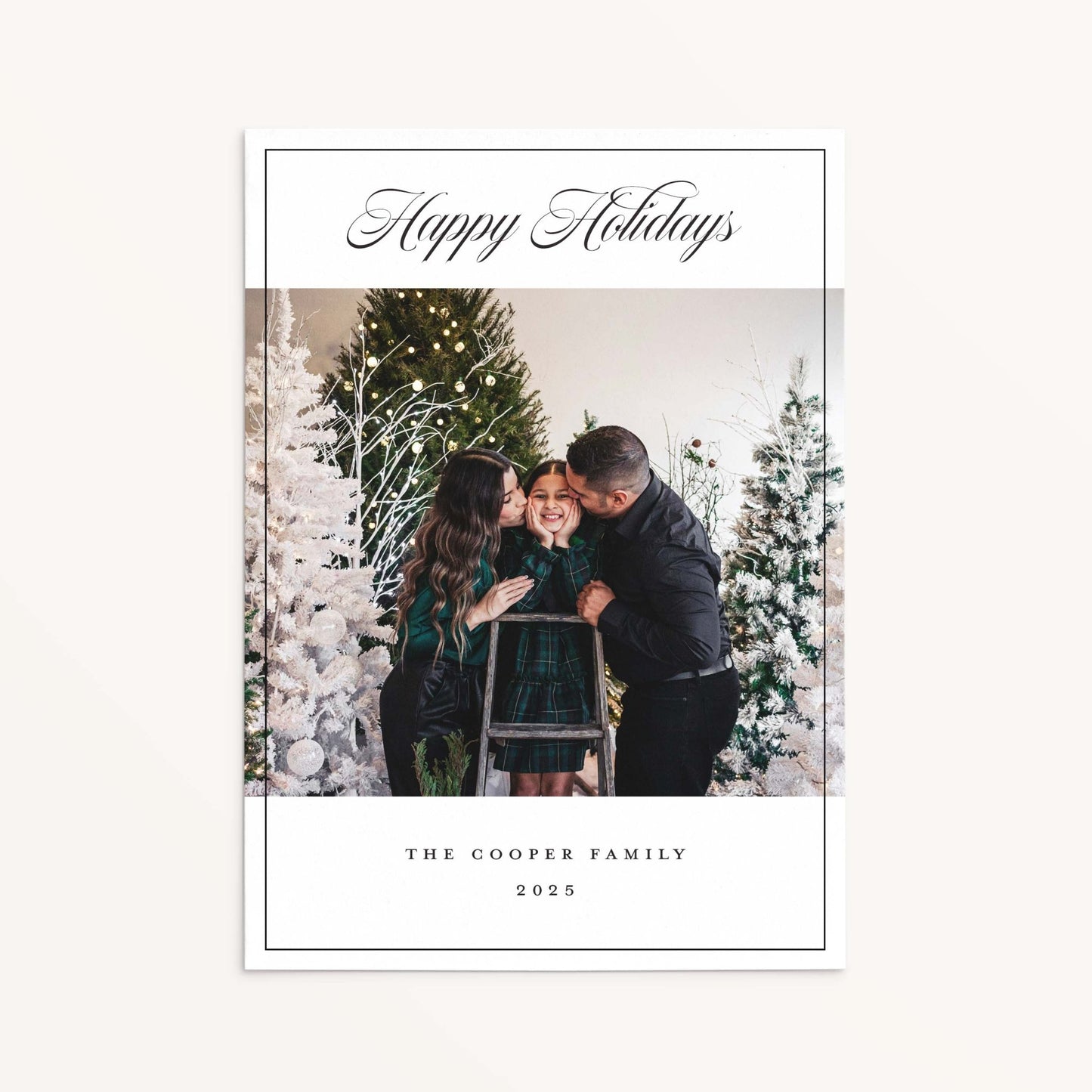 Chic family photo holiday card with black script Happy Holidays greeting and minimalist border.