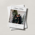 Cooper Family Chic photo holiday card in white with Happy Holidays script and a family photo, on a white envelope