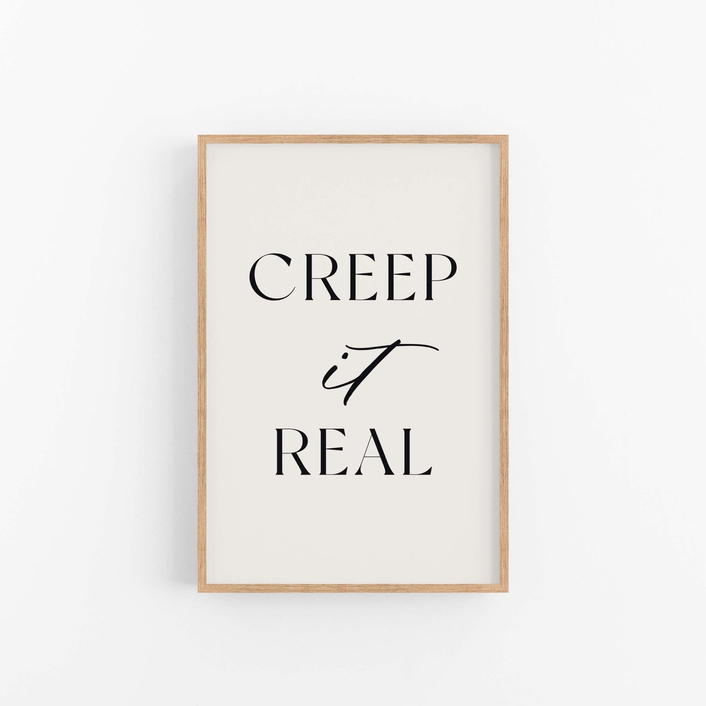 Framed poster with 'CREEP it REAL' text on a white background