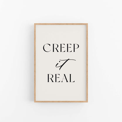 Framed poster with 'CREEP it REAL' text on a white background