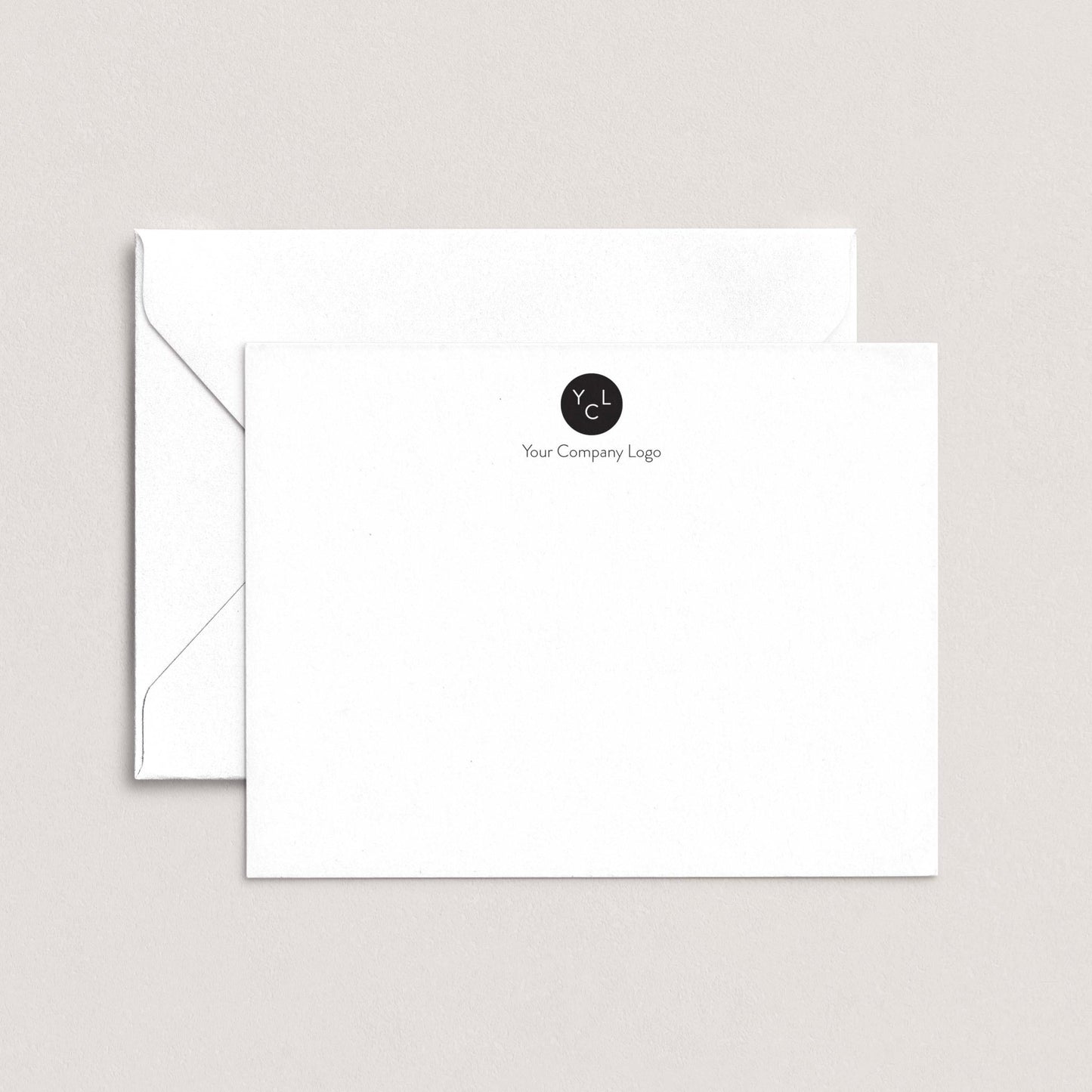 A white envelope with a black logo on the top right corner, sitting on top of a plain white background.