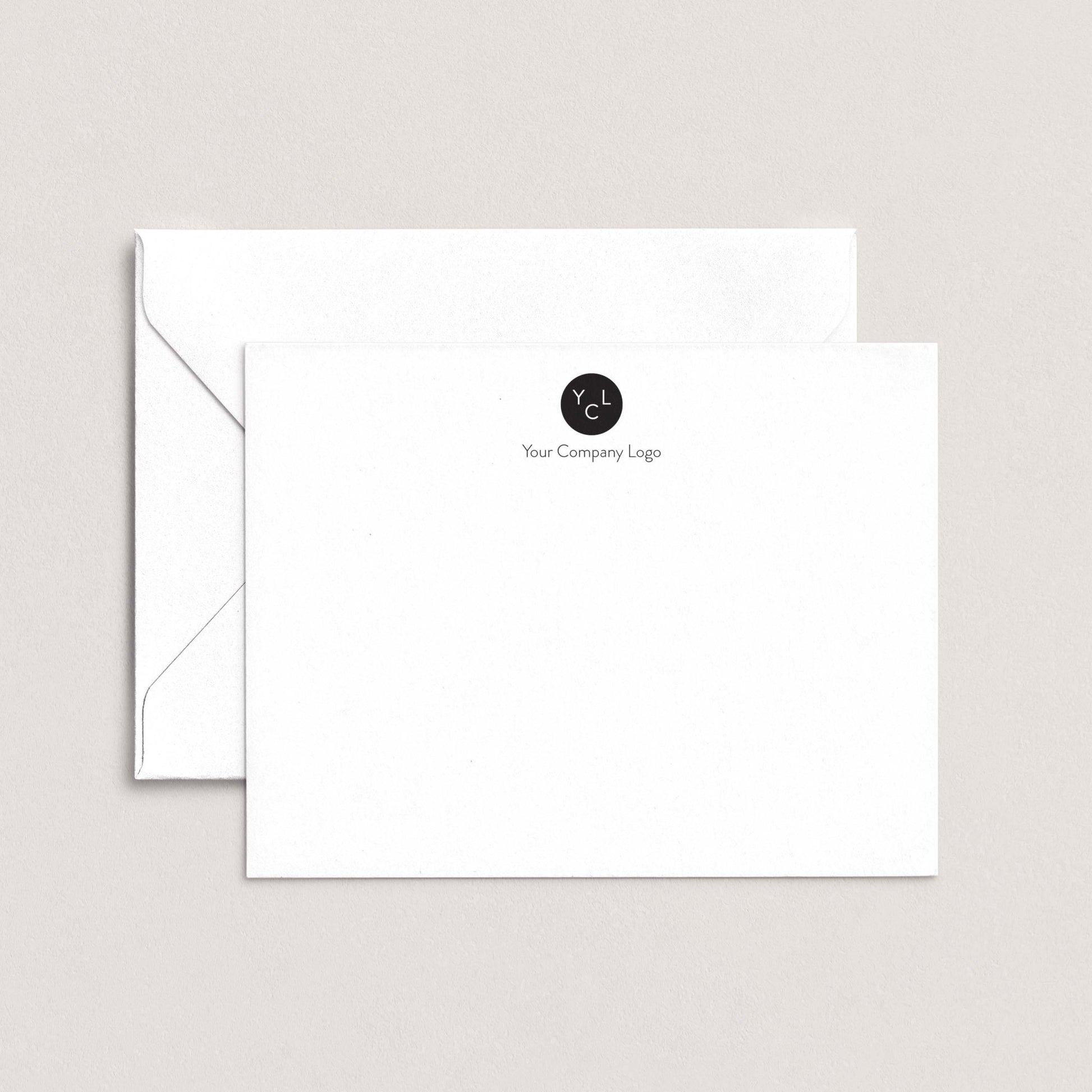 A white envelope with a black logo on the top right corner, sitting on top of a plain white background.