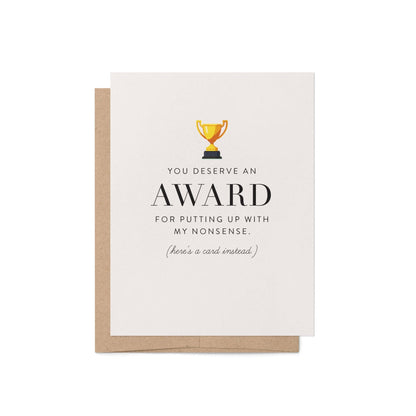 Funny award greeting card with trophy illustration and kraft envelope