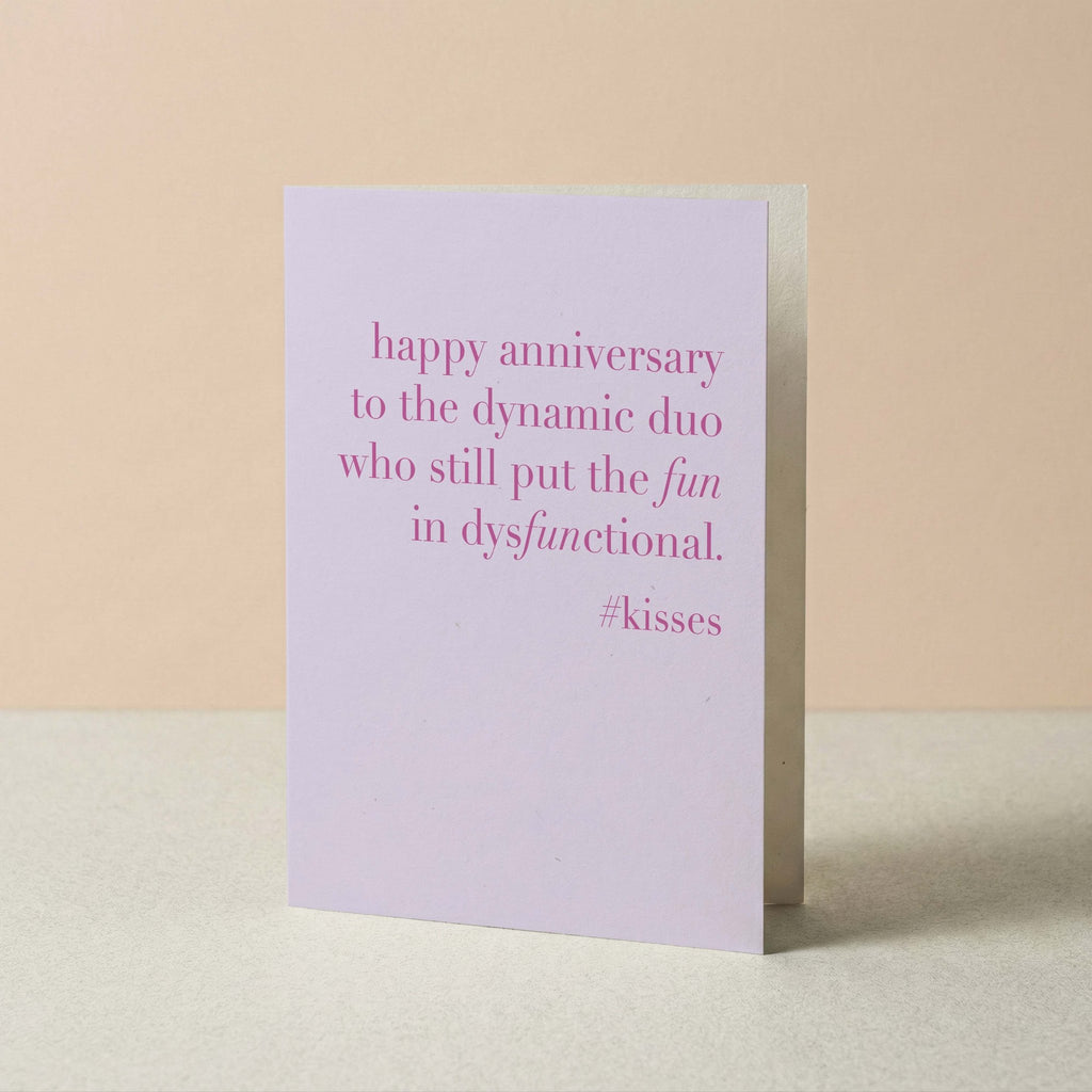 Greeting card with pink text on a beige background