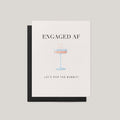 Greeting card with 'ENGAGED AF' text and champagne glass illustration on a beige background
