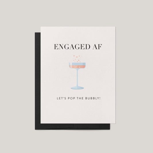 Greeting card with 'ENGAGED AF' text and champagne glass illustration on a beige background