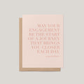 Greeting card with pink text on a light gray background