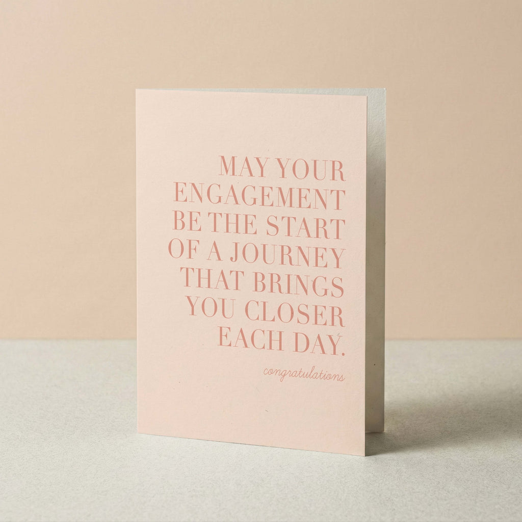 Greeting card with pink text on a beige background