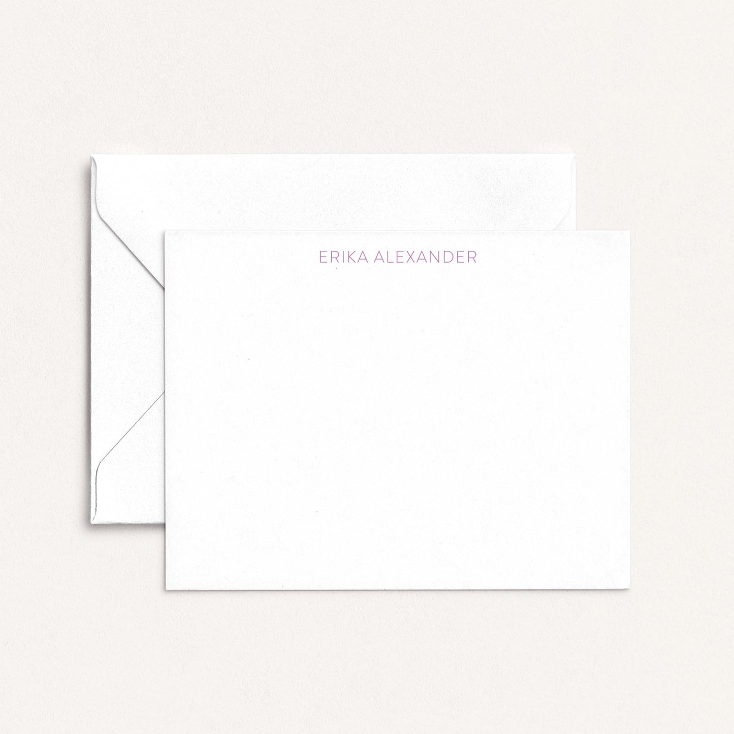 Personalized notecard with the name Erika Alexander in soft lavender font, paired with a white envelope on a neutral background.