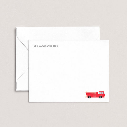 A white envelope with a red fire truck illustration on the front.
